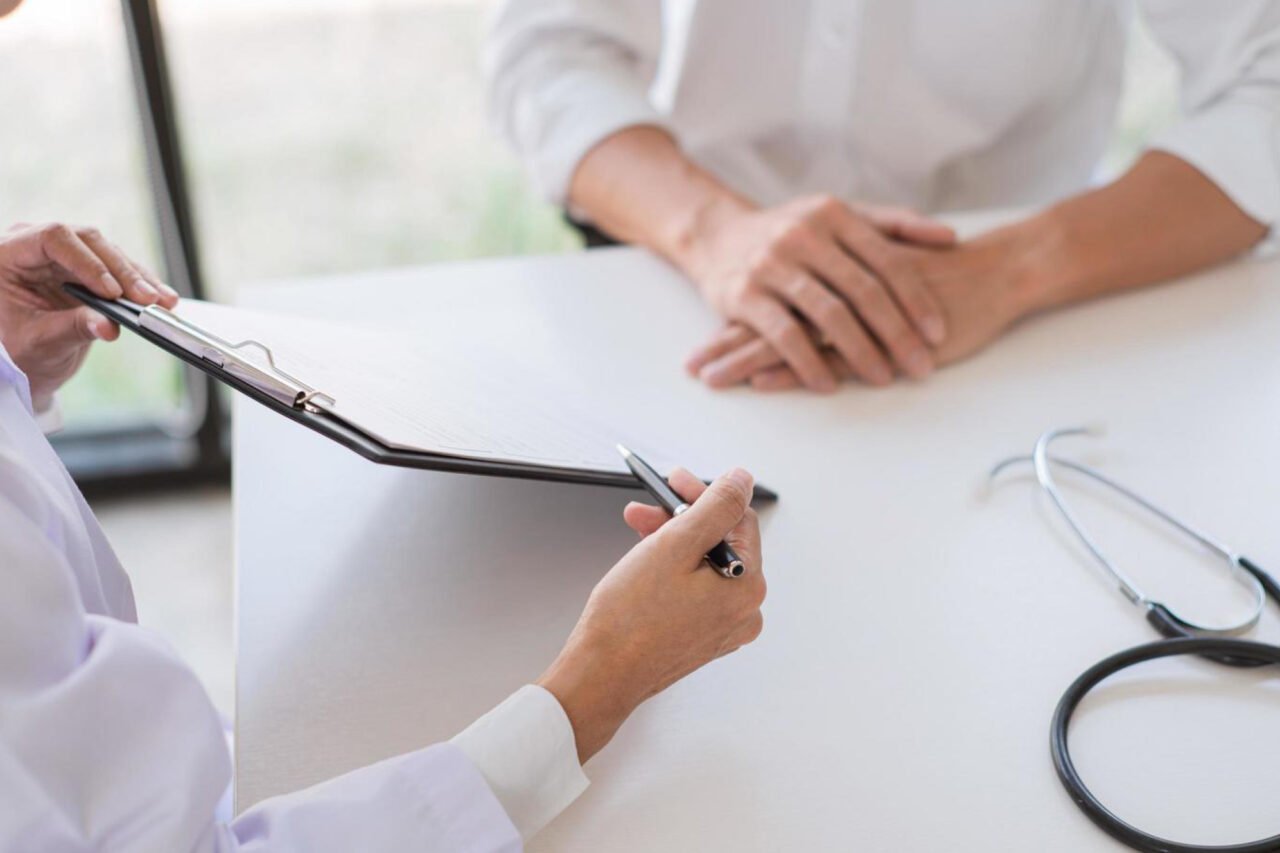 A Doctor consulting a patient